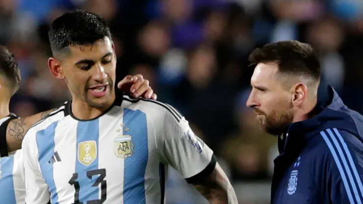 Cristian Romero and Lionel Messi of Argentina leave the field.