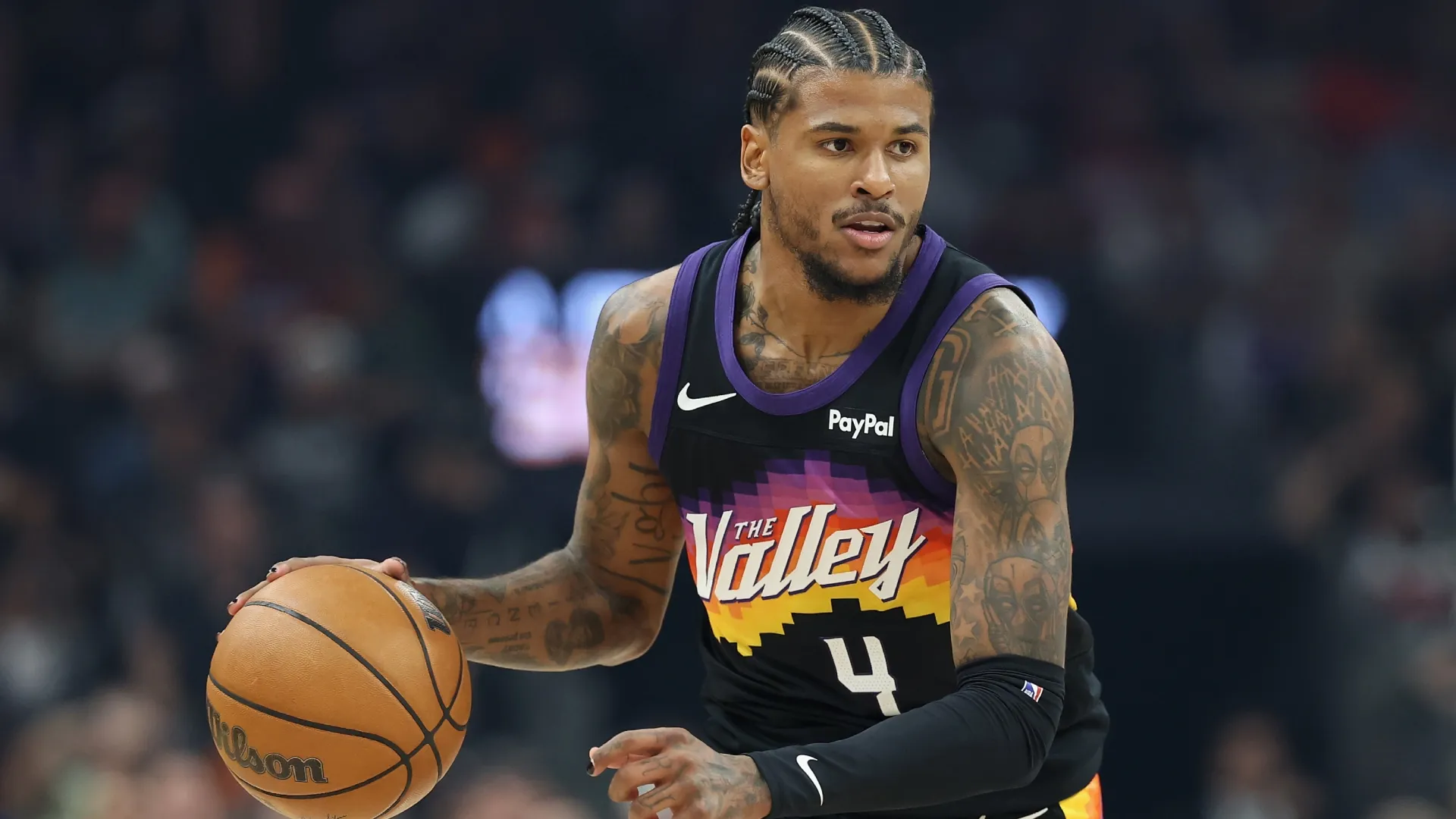 Jalen Green of the Suns handles the ball during the first half of an NBA game in 2026 (Source: Christian Petersen/Getty Images)