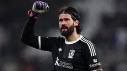 Alisson Becker of Liverpool celebrates victory following the Premier League match