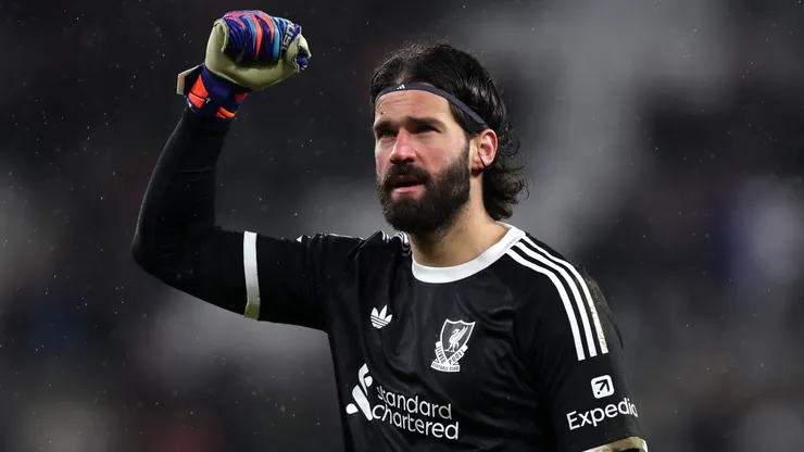 Alisson Becker of Liverpool celebrates victory following the Premier League match