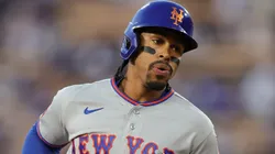 Francisco Lindor #12 of the Mets runs the bases after hitting a home run.