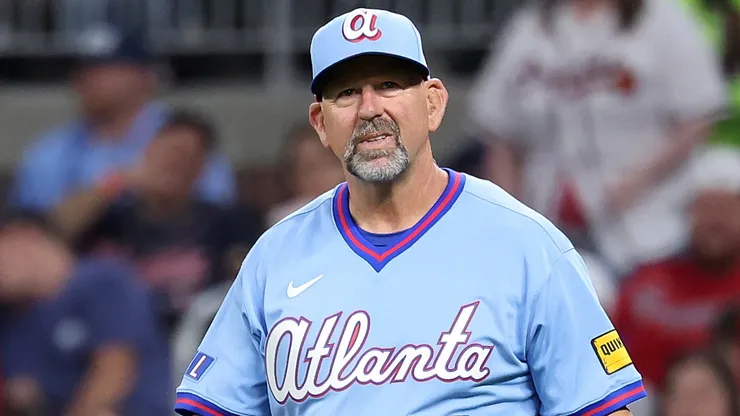 Manager Walt Weiss #22 of the Atlanta Braves walks out to the mound.