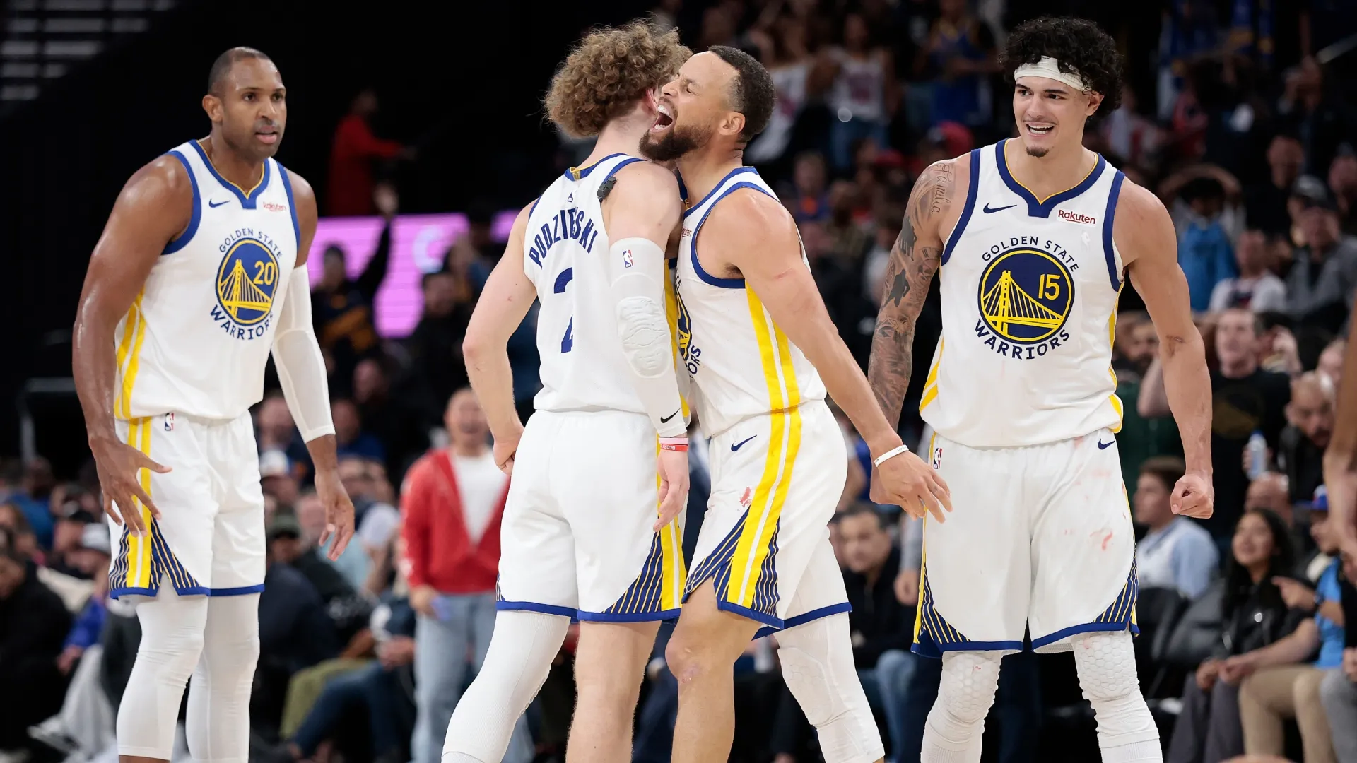 Stephen Curry reacts with Brandin Podziemski #2 after a three-point shot (Source: Ronald Martinez/Getty Images)