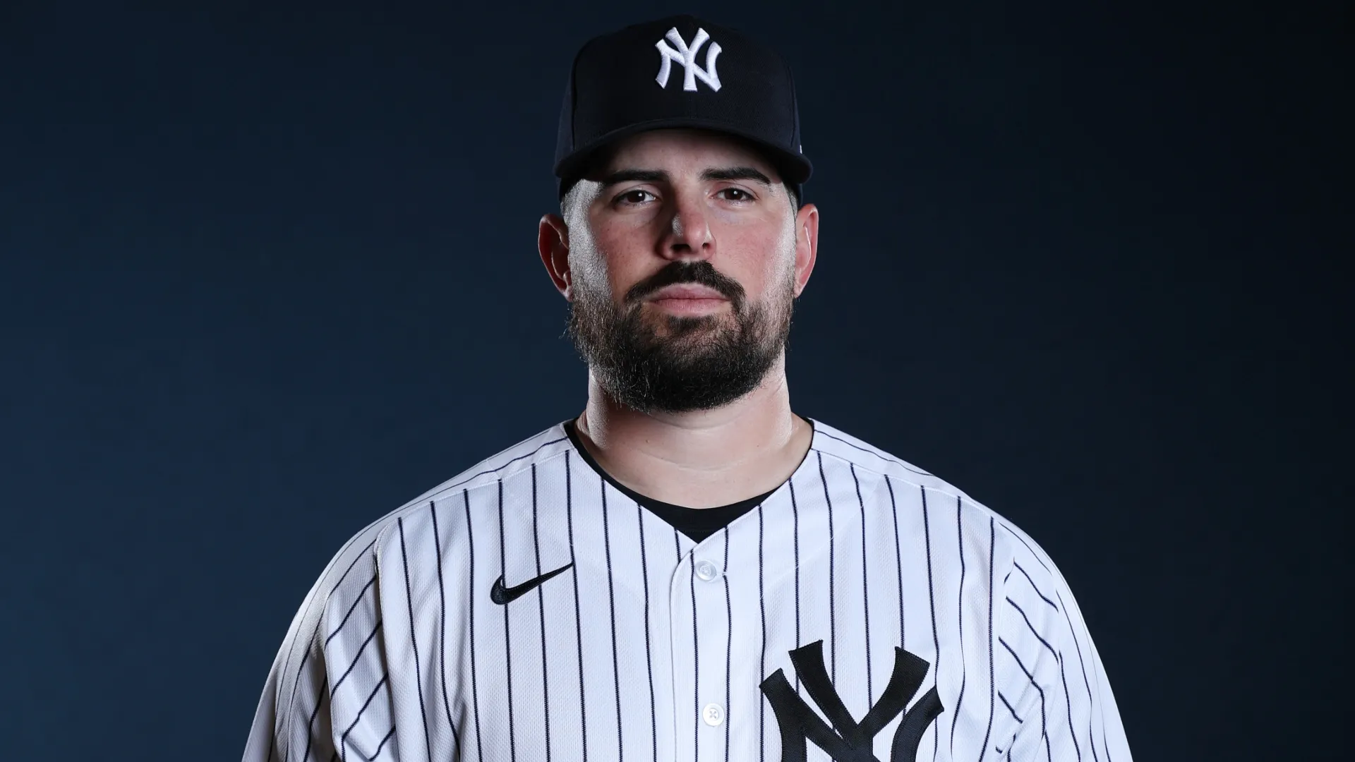 Carlos Rodón #55 of the Yankees poses for a photo during Spring Training. Chris Graythen/Getty Images