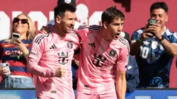Lionel Messi celebrates a goal with Daniel Pinter.