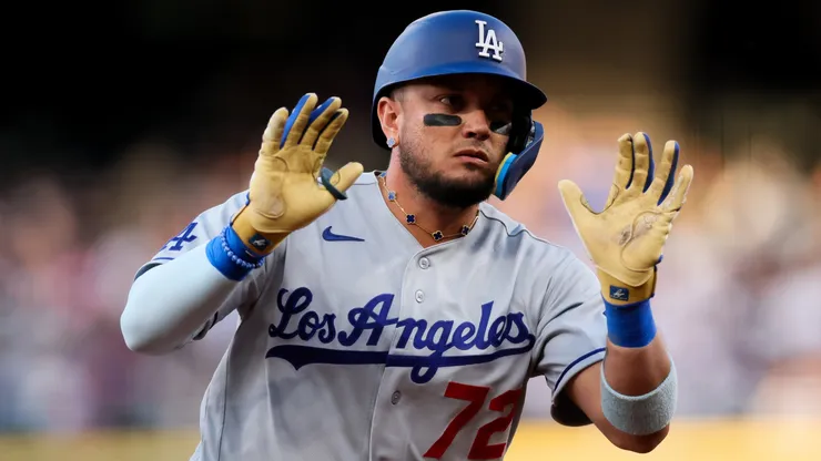 Miguel Rojas #72 of the Dodgers celebrates towards the dugout.