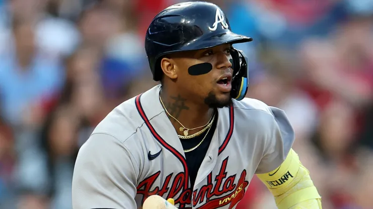Ronald Acuña Jr. #13 of th Braves hits a single.