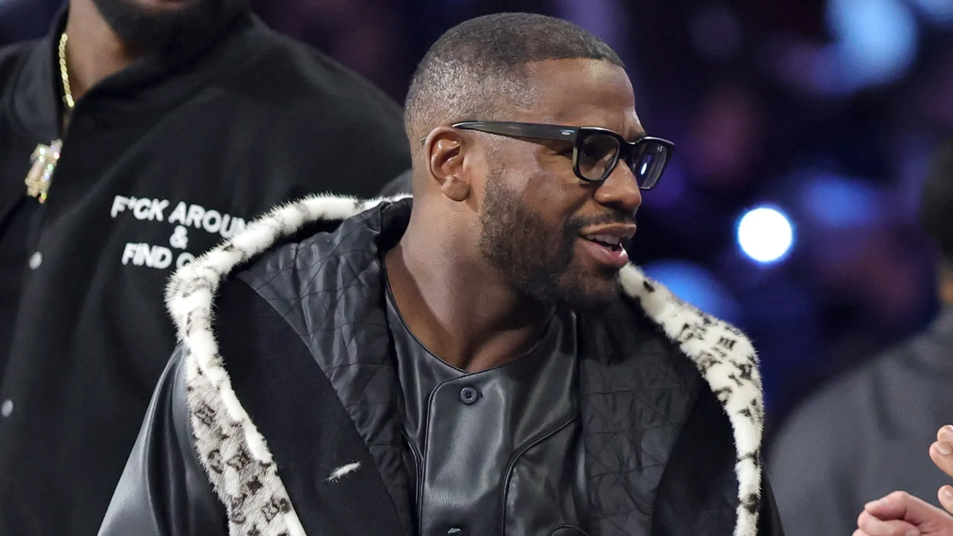 Floyd Mayweather Jr. greets people at halftime of the championship game of the Emirates NBA Cup. Ethan Miller/Getty Images