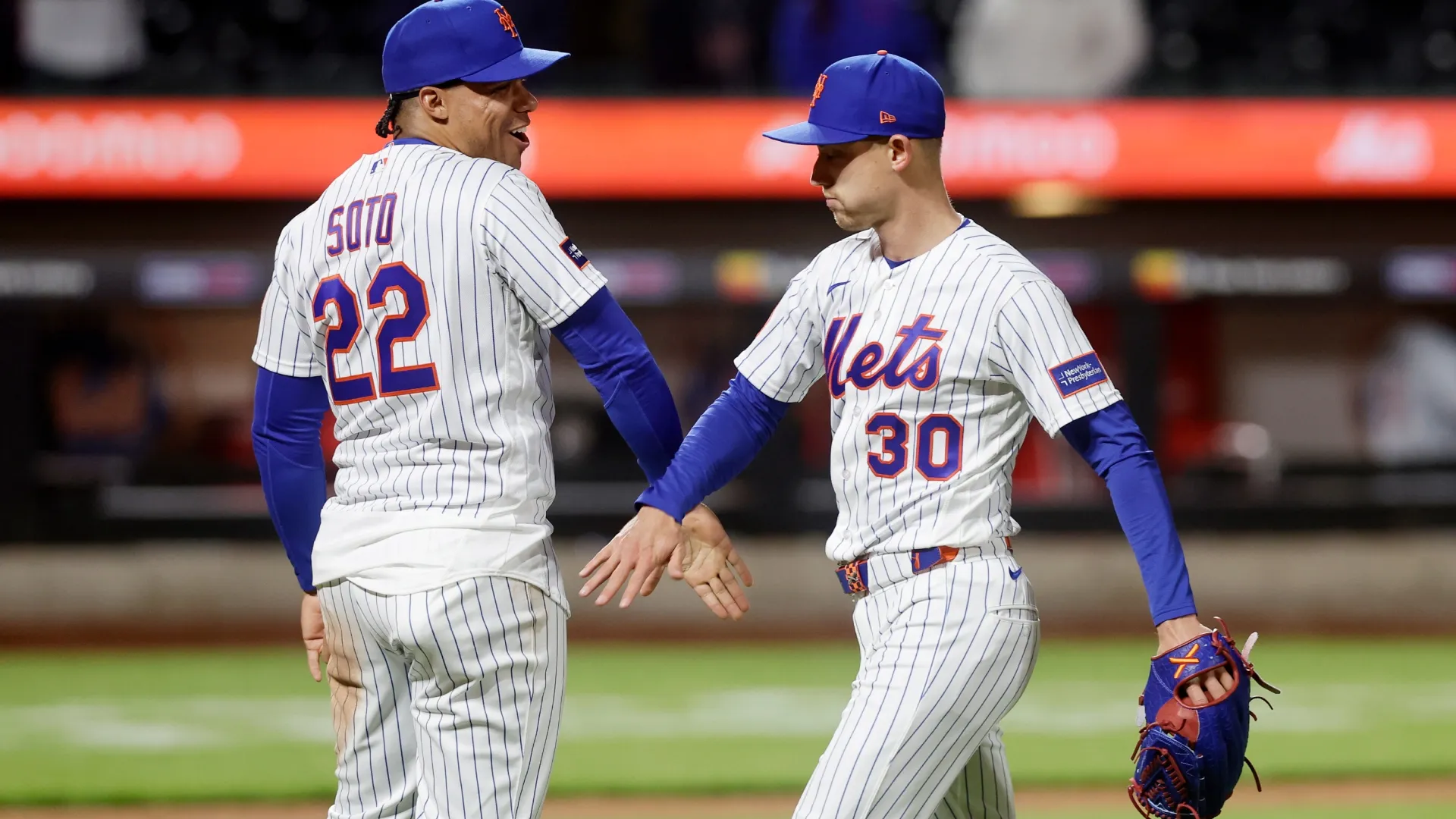 Juan Soto #22 and Luke Weaver #30 of the Mets celebrate after defeating the Twins. Jim McIsaac/Getty Images