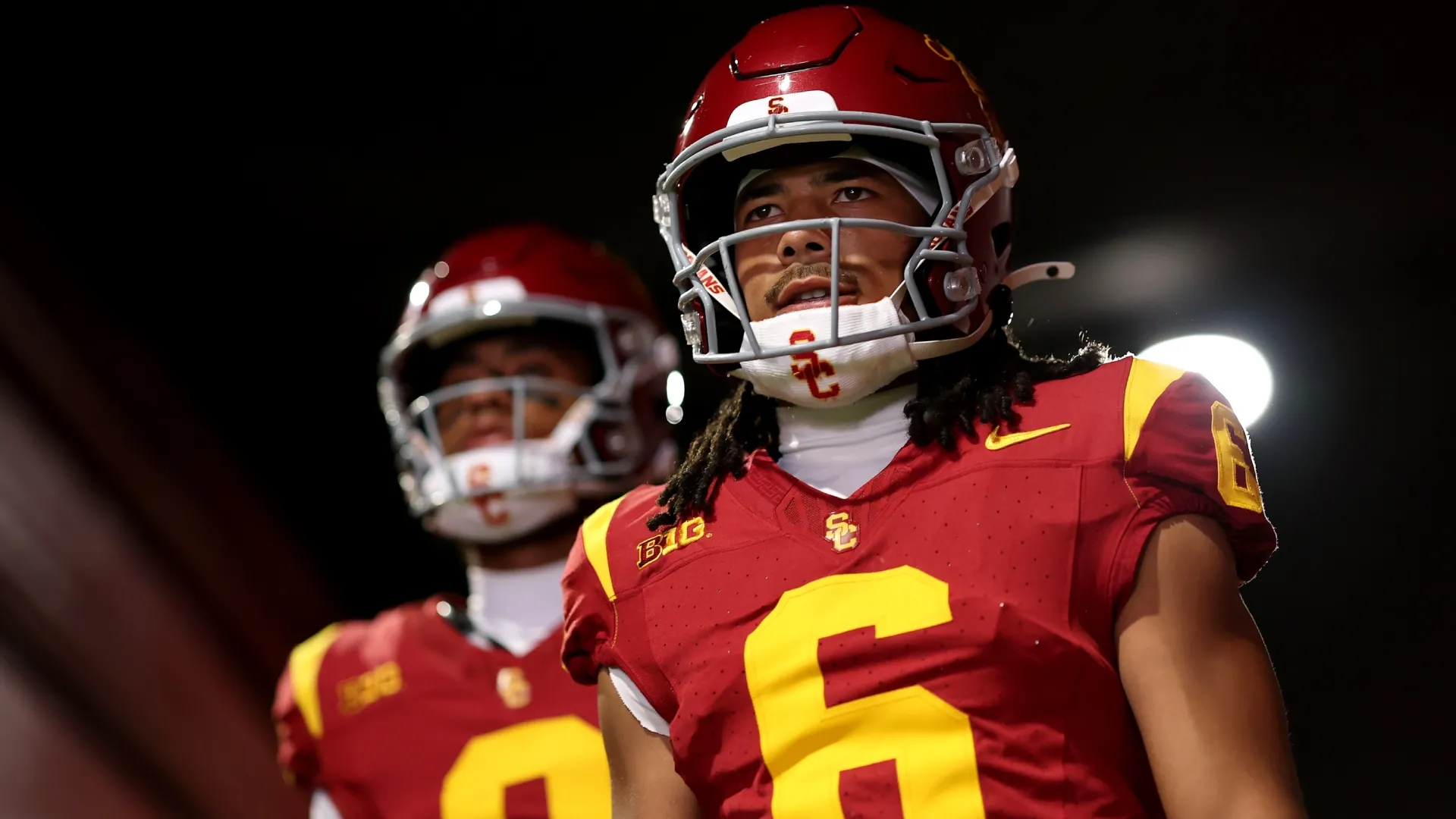 Makai Lemon #6 and Ja’Kobi Lane #8 of the USC Trojans walk out of the tunnel (Source: Luke Hales/Getty Images)