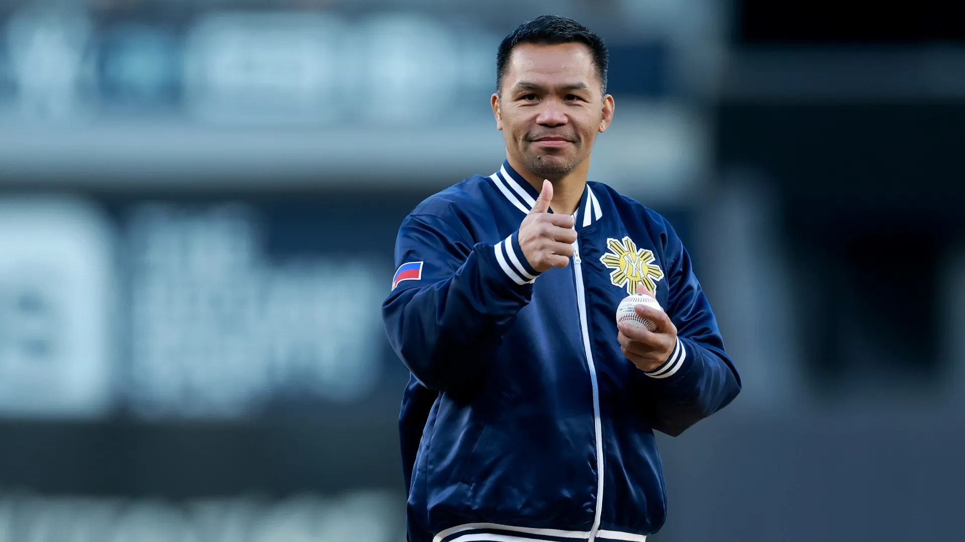 Manny Pacquiao prepares to throw out the ceremonial first pitch. Elsa/Getty Images