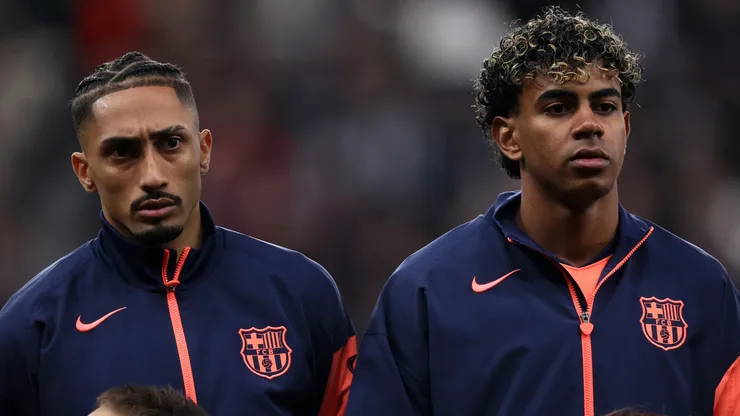 Raphinha and Lamine Yamal line up prior to the UEFA Champions League 2025/26 Round of 16 First Leg match.