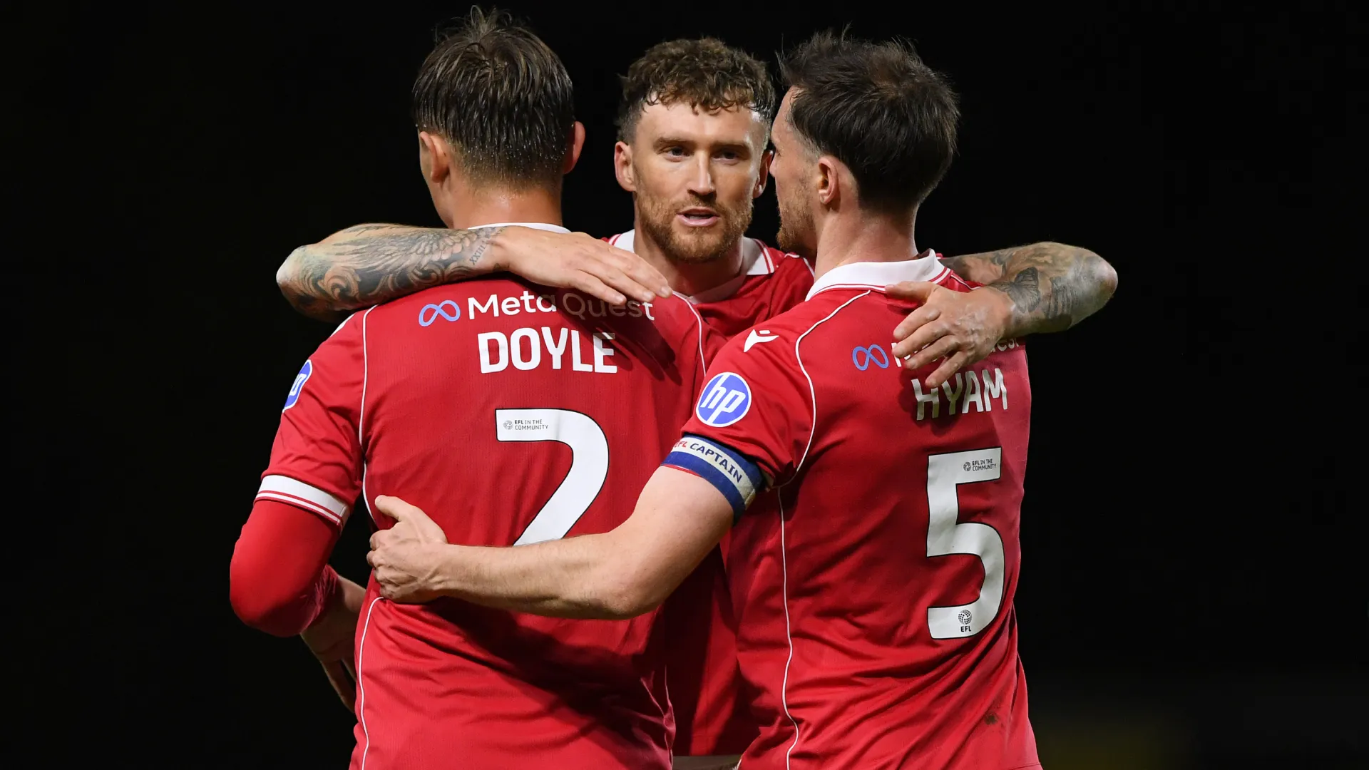Callum Doyle, Dan Scarr and Dominic Hyam celebrate a Wrexham victory. (Getty Images)