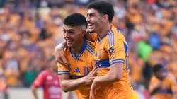 Juan Brunetta of Tigres UANL celebrates with a teammate