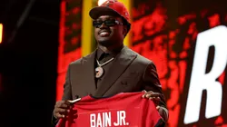 Rueben Bain Jr. of Miami celebrates after being selected fifteenth overall pick by the Tampa Bay Buccaneers
