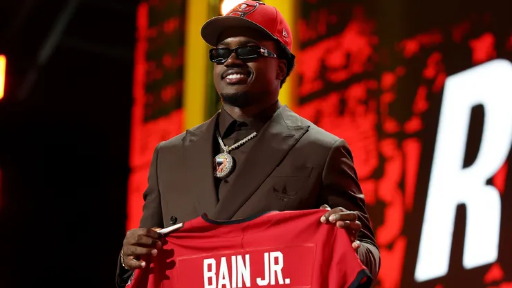 Rueben Bain Jr. of Miami celebrates after being selected fifteenth overall pick by the Tampa Bay Buccaneers