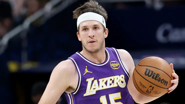 Austin Reaves #15 of the Los Angeles Lakers dribbles the ball.