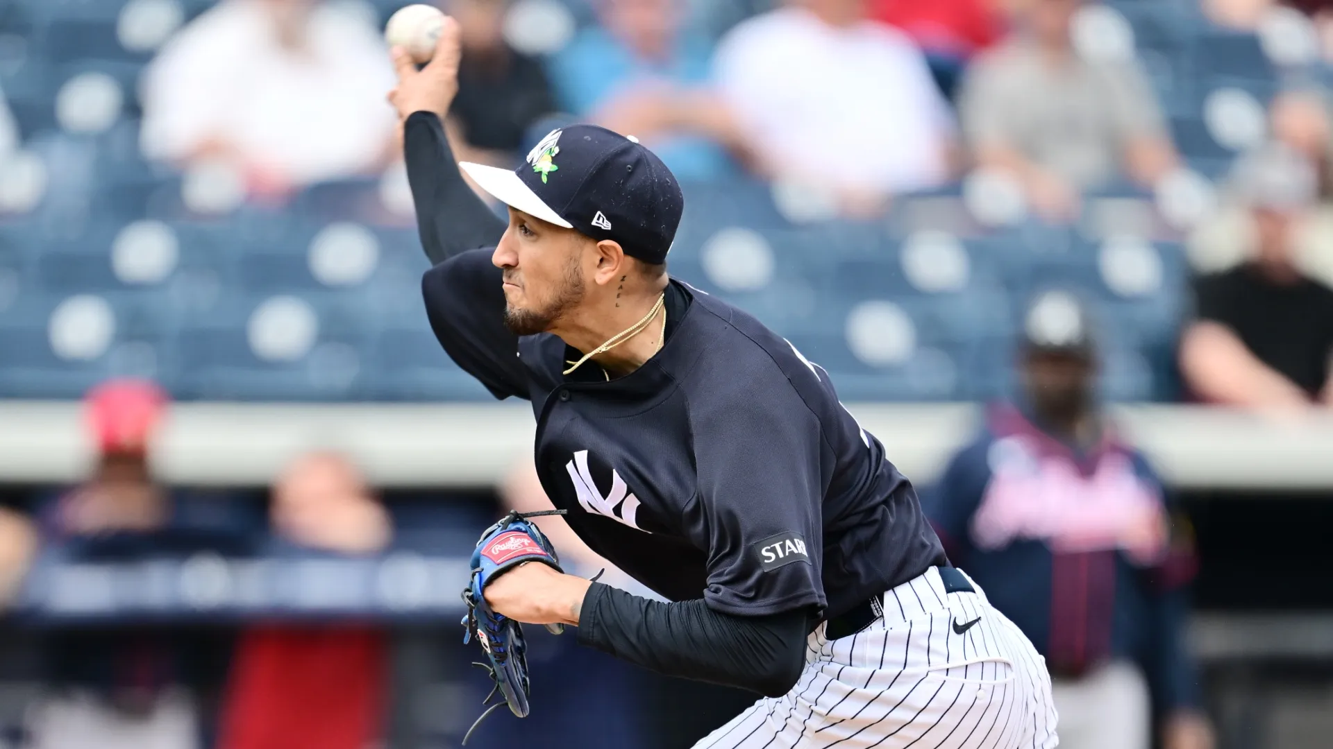 Elmer Rodríguez #76 of the Yankees delivers a pitch.  Julio Aguilar/Getty Images