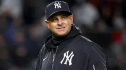 Aaron Boone #17 of the Yankees walks back to the dugout.