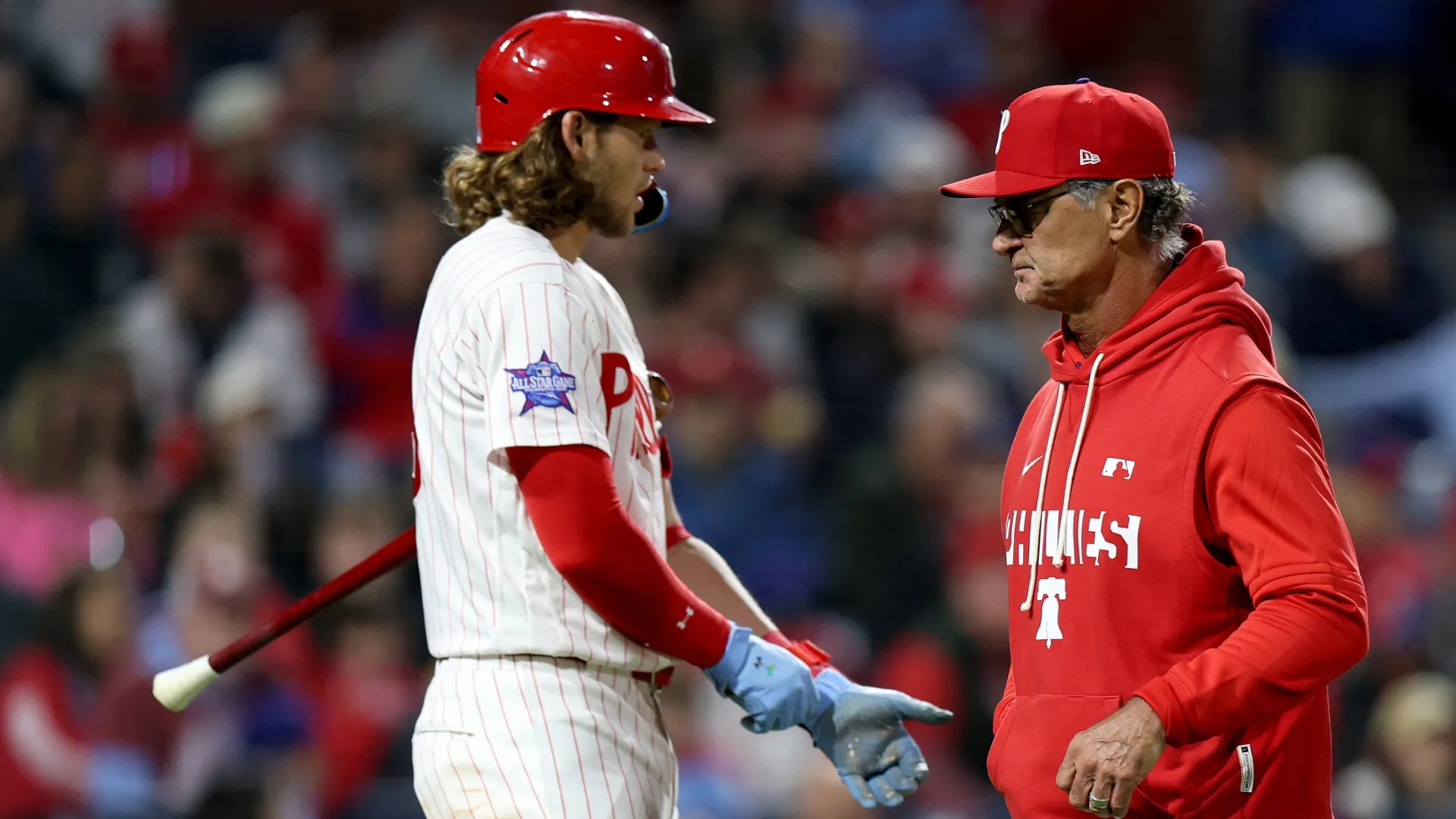 Don Mattingly, interim manager for the Phillies, walks off the field by Alec Bohm. Emilee Chinn/Getty Images