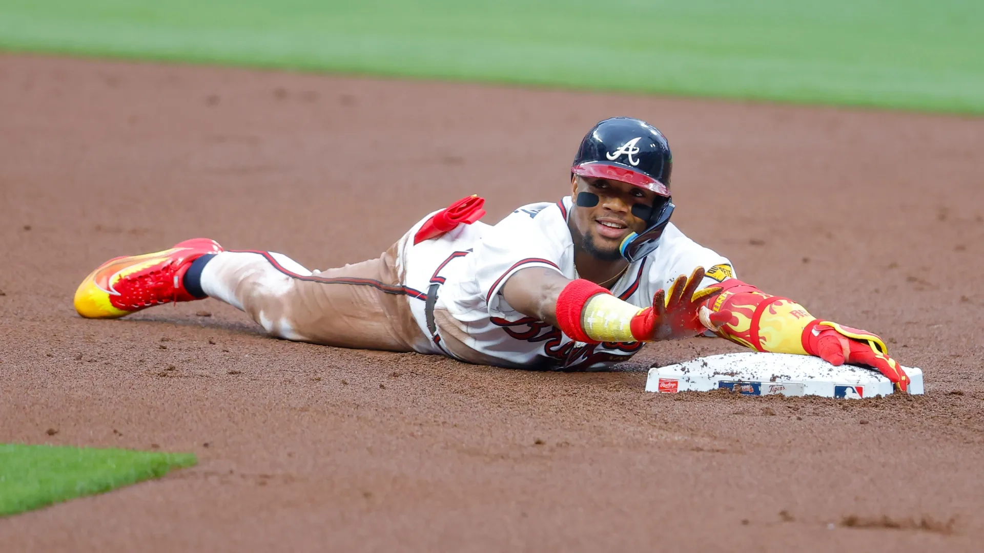 Ronald Acuna Jr. #13 of the Atlanta Braves reacts after a hitting a double. Todd Kirkland/Getty Images