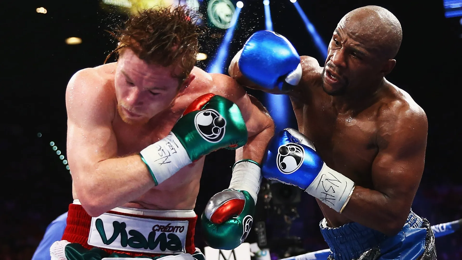 Floyd Mayweather Jr. throws a right to Canelo Alvarez. Al Bello/Getty Images