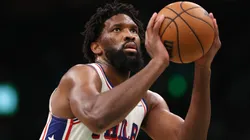 Joel Embiid #21 of the Philadelphia 76ers attempts a free throw against the Boston Celtics.