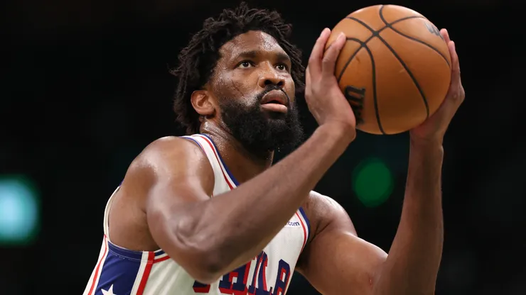 Joel Embiid #21 of the Philadelphia 76ers attempts a free throw against the Boston Celtics.