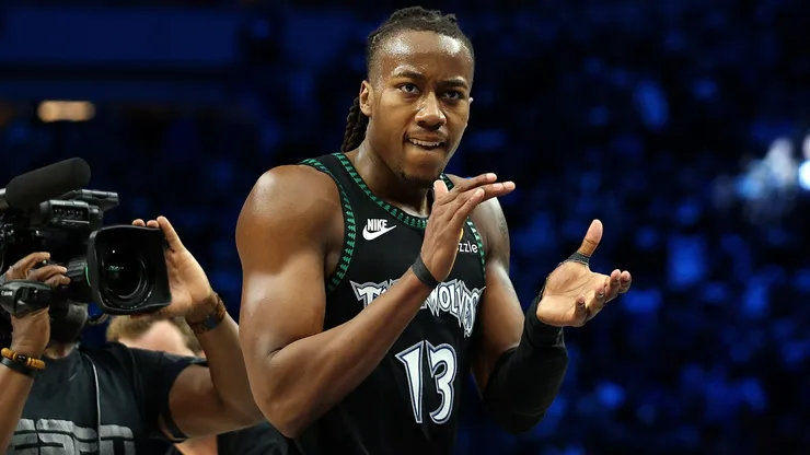 Ayo Dosunmu #13 of the Minnesota Timberwolves celebrates against the Denver Nuggets.