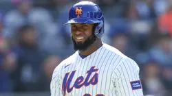 Luis Robert Jr. #88 of the New York Mets walks back to the dugout.