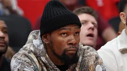 Kevin Durant sits courtside during Game 4 against the Lakers