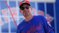 Carlos Mendoza #64 of the Mets walks onto the practice field during spring training workouts.