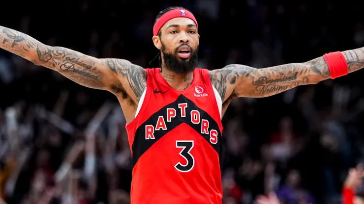 Brandon Ingram #3 of the Toronto Raptors celebrates a teammate's basket against the Brooklyn Nets.