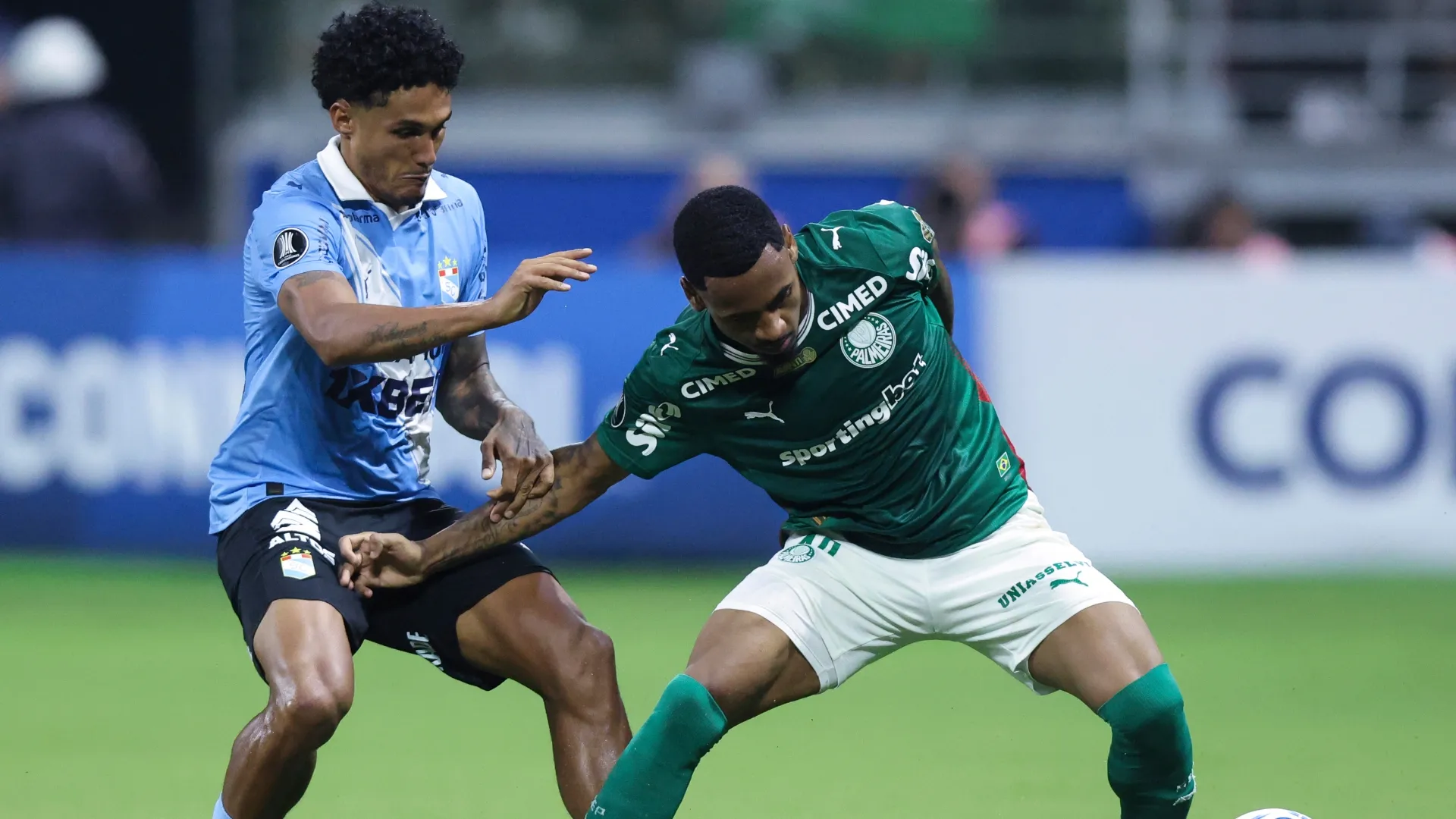 Allan of Palmeiras tries to control the ball against Cristiano Silva of Sporting Cristal – Alexandre Schneider/Getty Images
