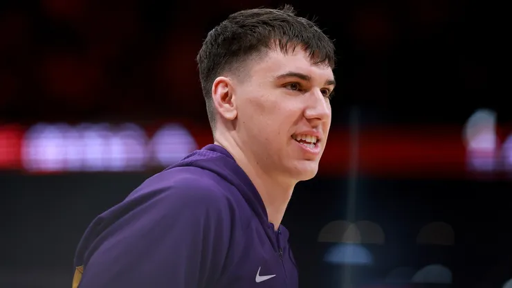 Jake LaRavia #12 of the Los Angeles Lakers looks on.