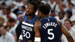 Anthony Edwards #5 of the Minnesota Timberwolves talks with Julius Randle #30.