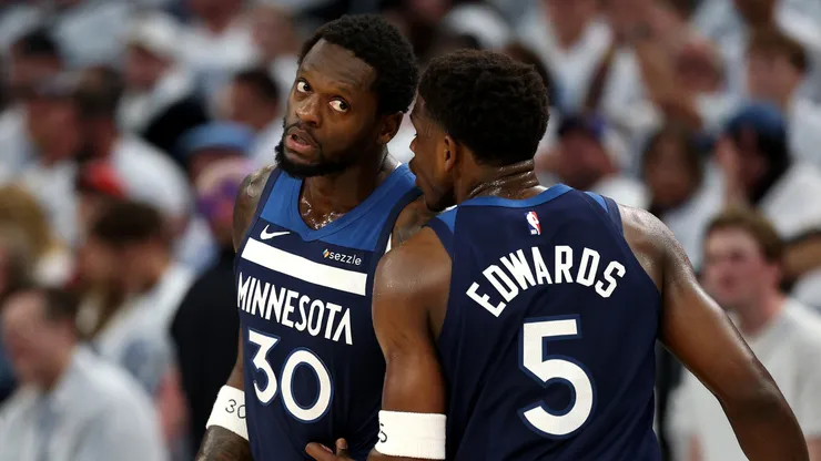 Anthony Edwards #5 of the Minnesota Timberwolves talks with Julius Randle #30.