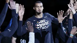 Victor Wembanyama #1 of the San Antonio Spurs takes to the court.