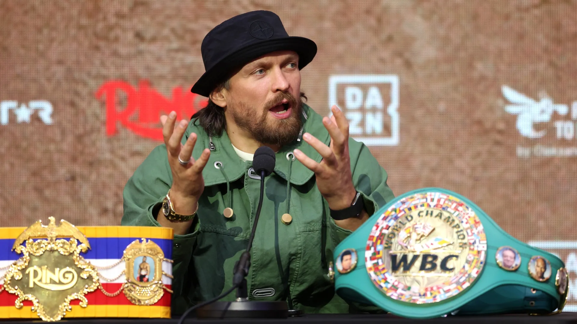 Oleksandr Usyk speaks to the media. Richard Pelham/Getty Images)
