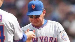 Manager Carlos Mendoza #64 of the New York Mets smiling.