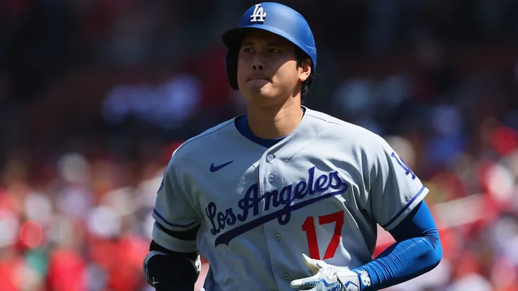 Shohei Ohtani #17 of the Los Angeles Dodgers returns to the dugout.