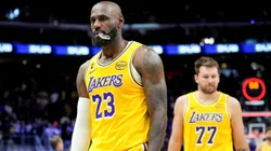 LeBron James #23 and Luka Doncic #77 of the Los Angeles Lakers walk off the court.