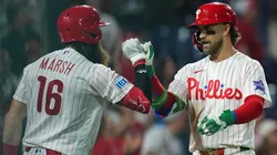 Bryce Harper #3 of the Philadelphia Phillies celebrates his two-run home run with Brandon Marsh #16.