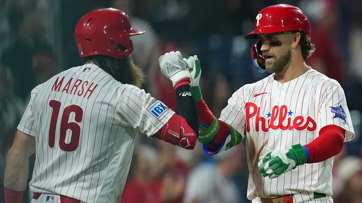 Bryce Harper #3 of the Philadelphia Phillies celebrates his two-run home run with Brandon Marsh #16.