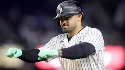Jasson Dominguez #24 of the New York Yankees gestures at first base.