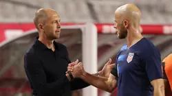 Gregg Berhalter (left) and Michael Bradley shake hands during a USMNT game.
