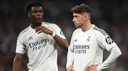 Aurelien Tchouameni and Federico Valverde of Real Madrid look on.