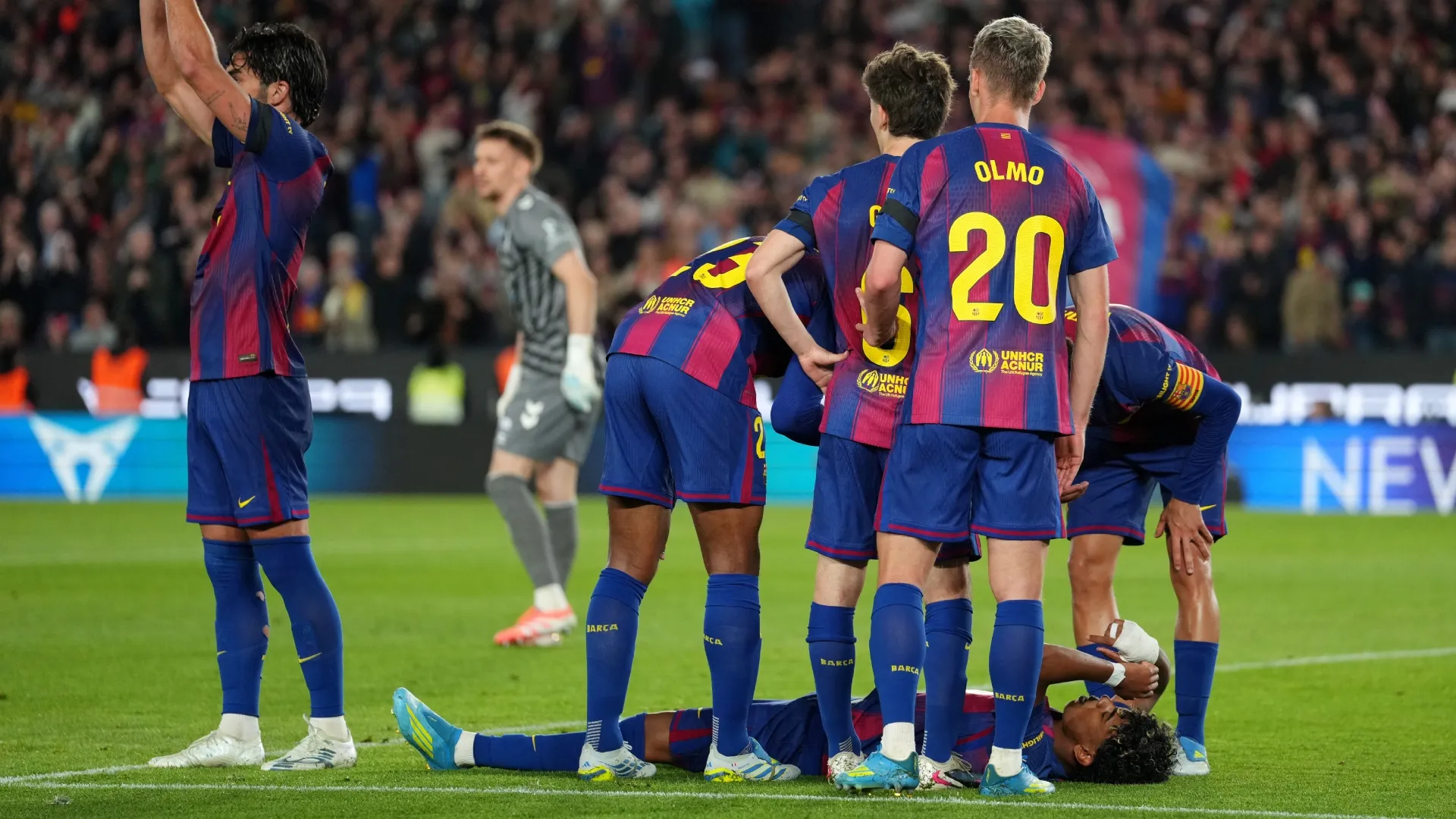 Lamine Yamal reacts to an injury during the LaLiga EA Sports match (Source: Alex Caparros/Getty Images)