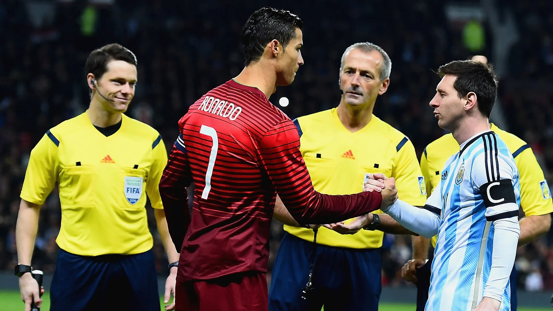Cristiano Ronaldo shakes hands with Lionel Messi prior to a friendly game. (Getty Images)
