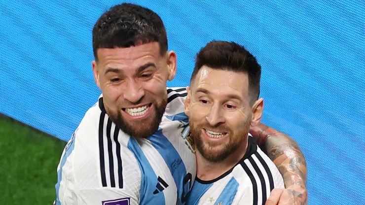 Nicolas Otamendi and Lionel Messi celebrate a goal for Argentina.